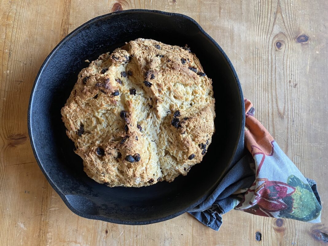 irish soda bread in cast iron pan on counter