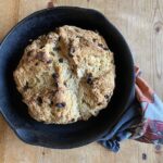 irish soda bread in cast iron pan on counter