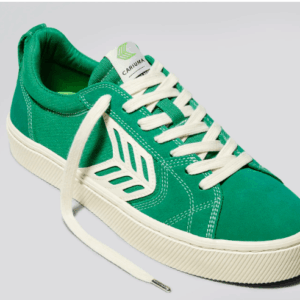 A single green shoe with white detailing from Brazilian brand Cariuma.