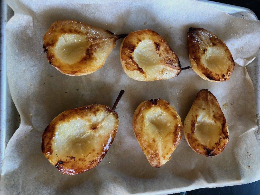 Roasted pears on a baking sheet.