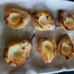 Roasted pears on a baking sheet.