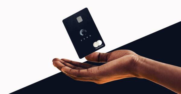 A hand holding the Aspiration Zero Credit Card.