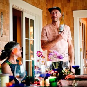 Sam Decker with a bottle of wine