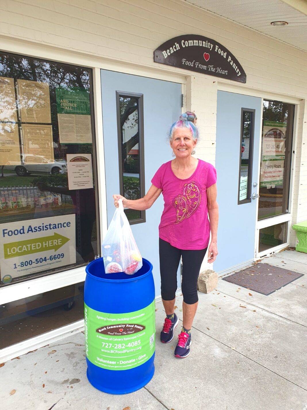 Diane Daniel donates to the community food pantry