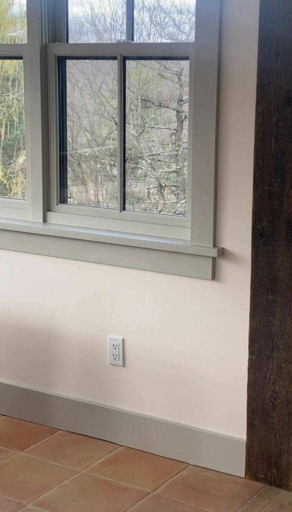 Window trim painted Met Grey and wall painted Creamery White.