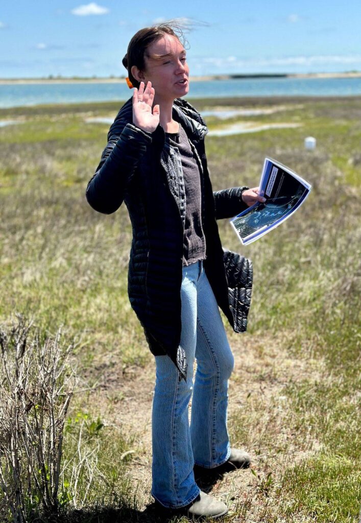 Sydney Pigott, education coordinator at Felix Neck, speaks to students about efforts to preserve Island salt marshes.