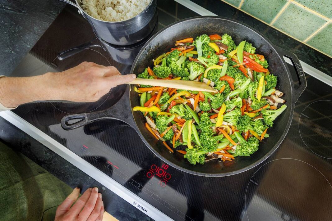 Vegetable stir fry on an induction cooktop