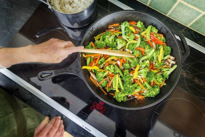 Vegetable stir fry on an induction cooktop