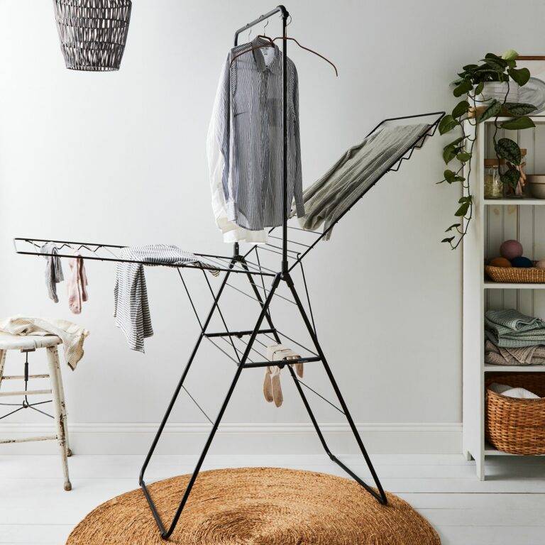A drying rack with clothes on it. 