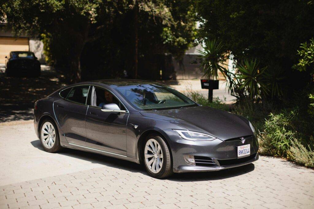 Tesla in driveway