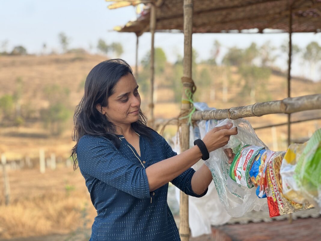 Amita Deshpande drying plastic hung on a line