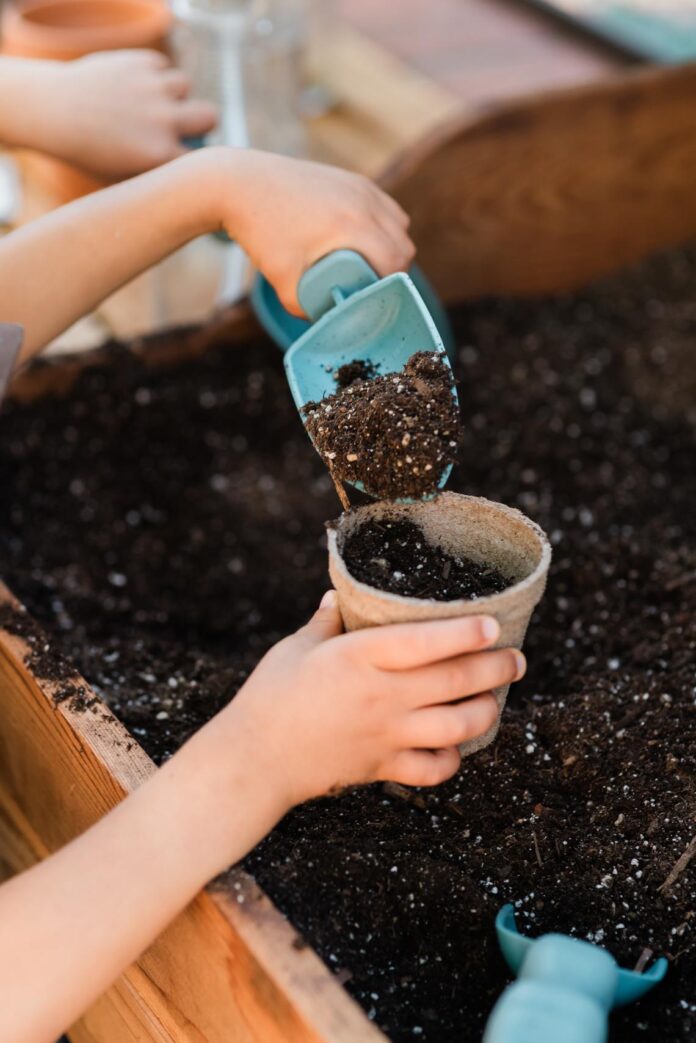 a child using gardening tools to dig