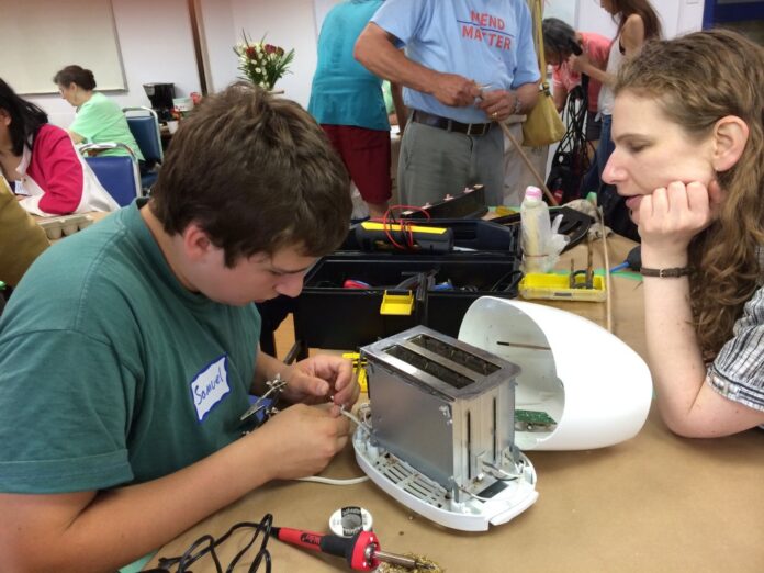 Repairing a toaster at a repair cafe