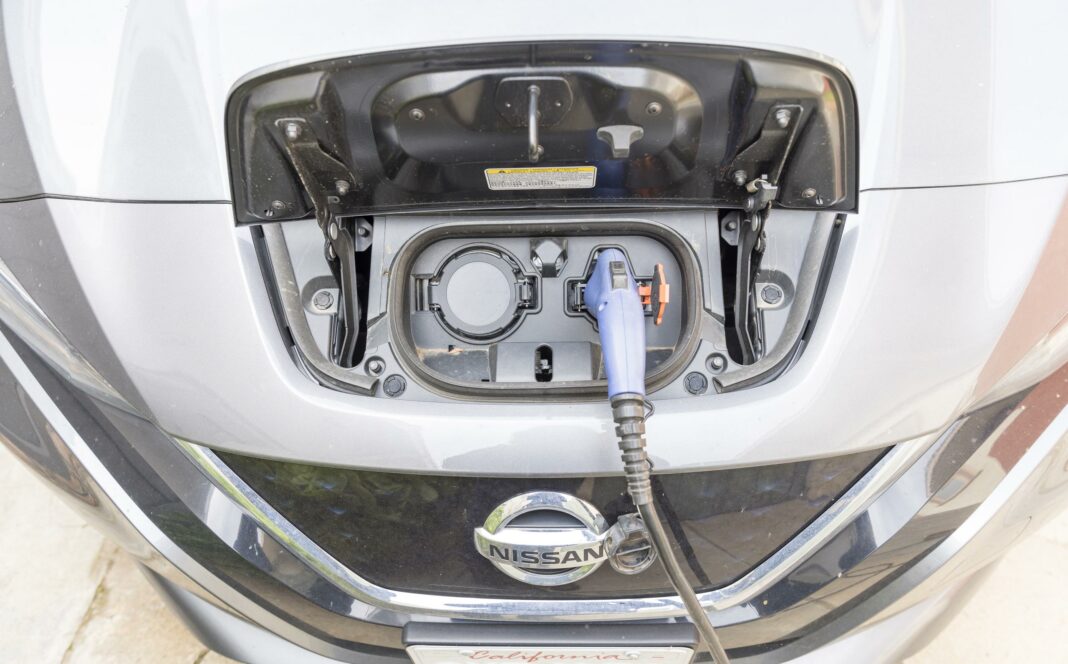 closeup of Nissan electric vehicle charging