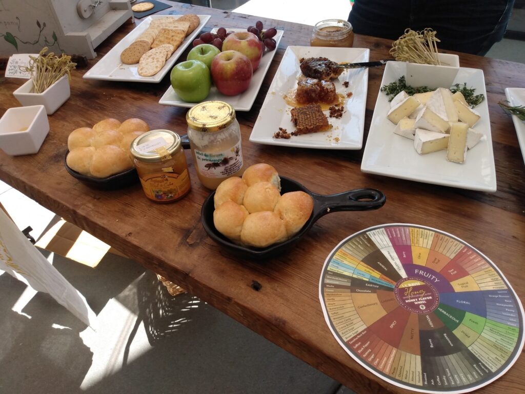 table with apples, cheese and honey 