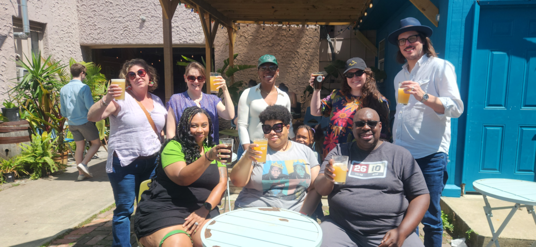 The Alliance for Affordable Energy Staff enjoy a Watch Dawg beer at Courtyard Brewery.