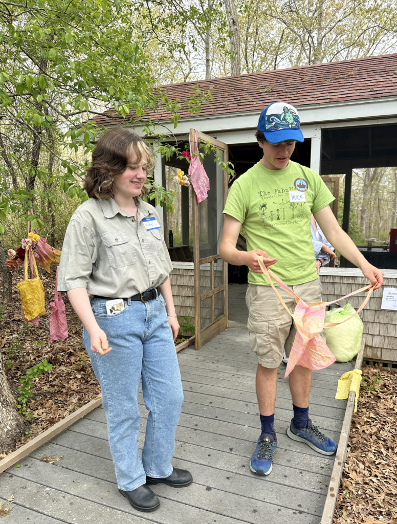 A student learns how to dye fabric with plants.