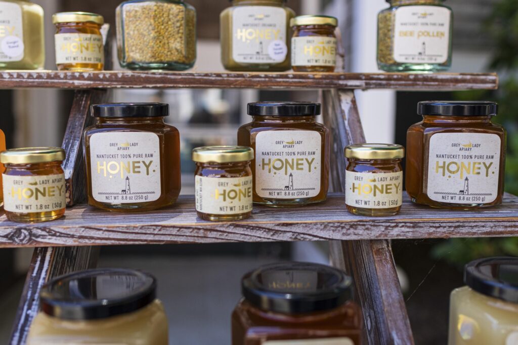 A line of jars filled with honey.
