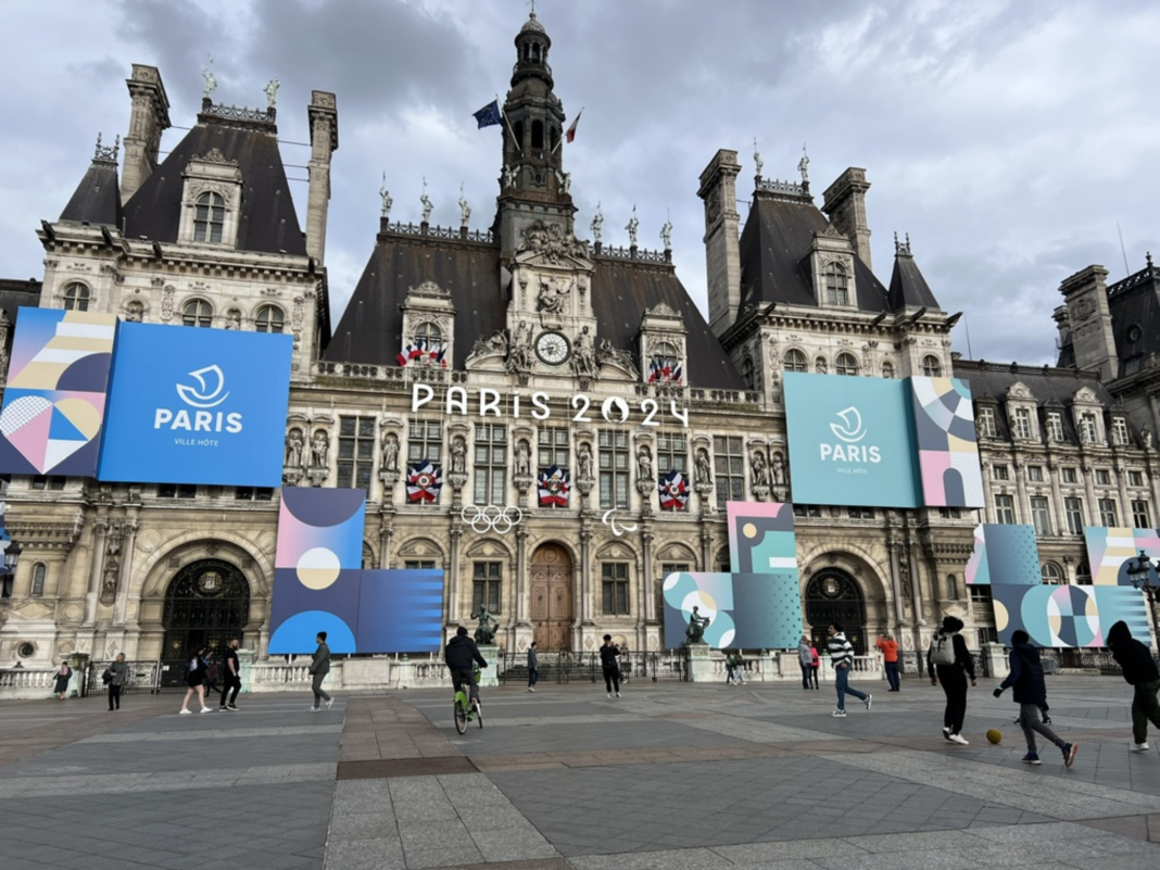 Olympic banners hang on the front of l'Hotel de Ville