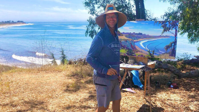 man painting on bluff