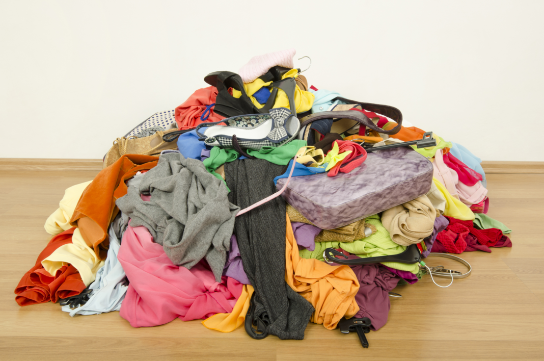 Pile of clothes thrown on the ground.