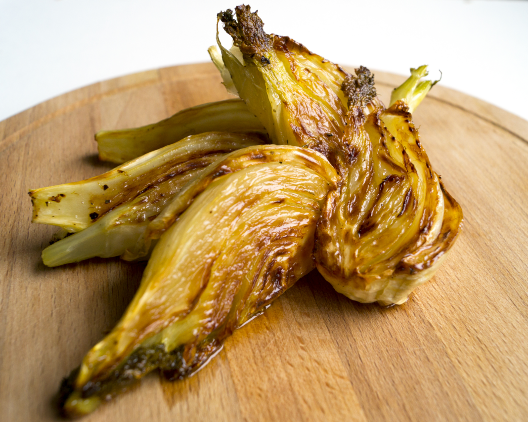 Roasted Fennel on a wooden board.
