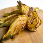 Roasted Fennel on a wooden board.