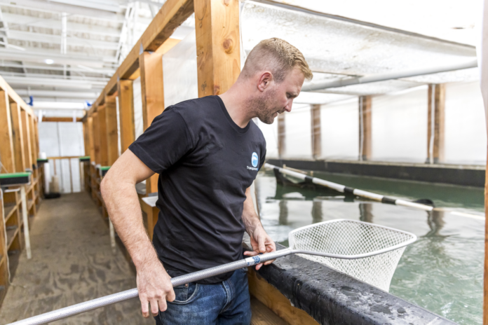 Man holding a fishing net.