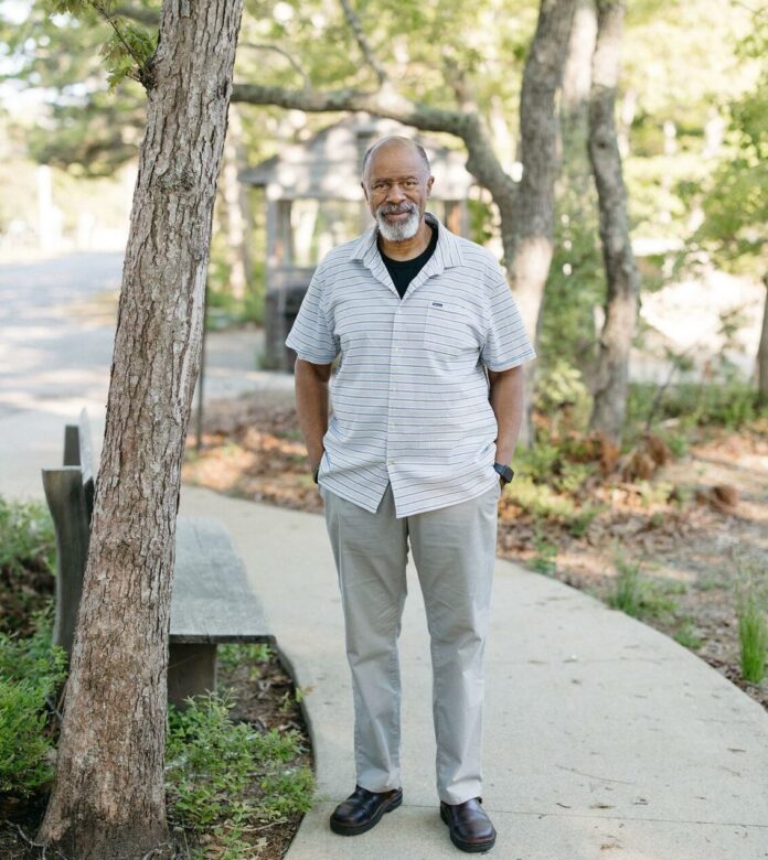 ewell hopkins standing by tree outdoors