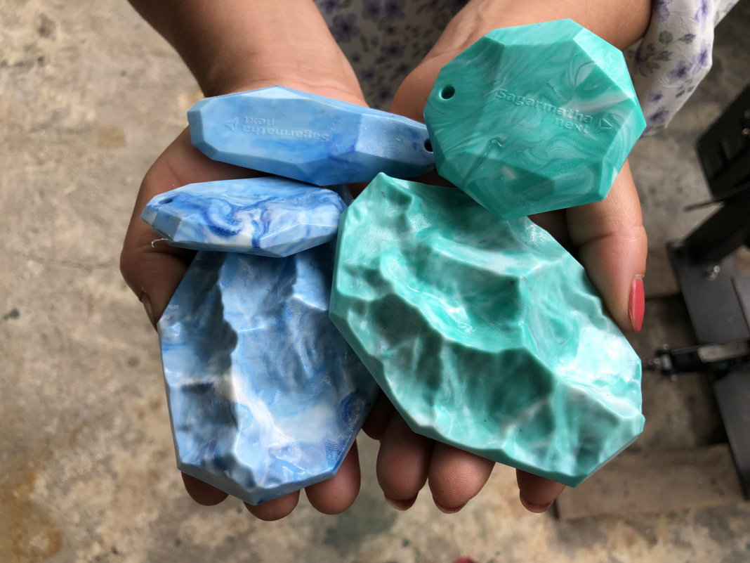 Plastic remade stones in teal.