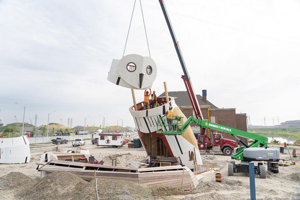 owl-shaped structure being installed