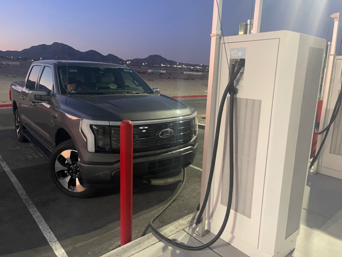 ev-charging-dusk-khalverson An electric truck at a charging station.