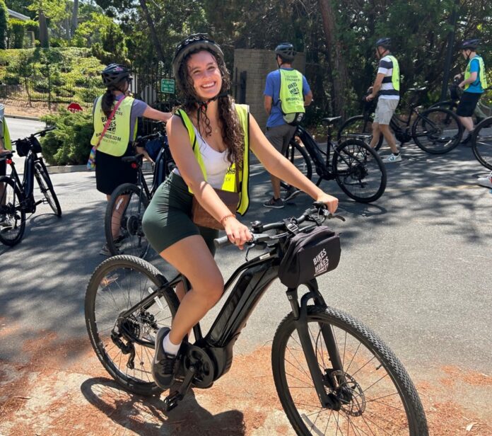 A woman riding a bike.