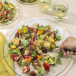 grilled sourdough panzanella served on multiple plates.