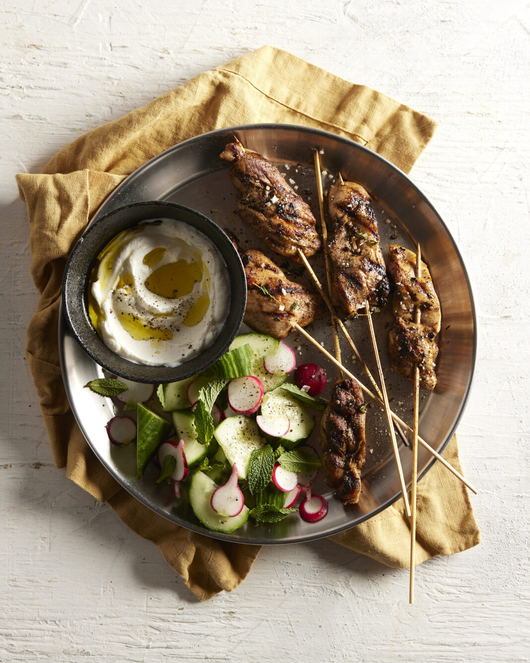marinated chicken thigh kebabs plated.