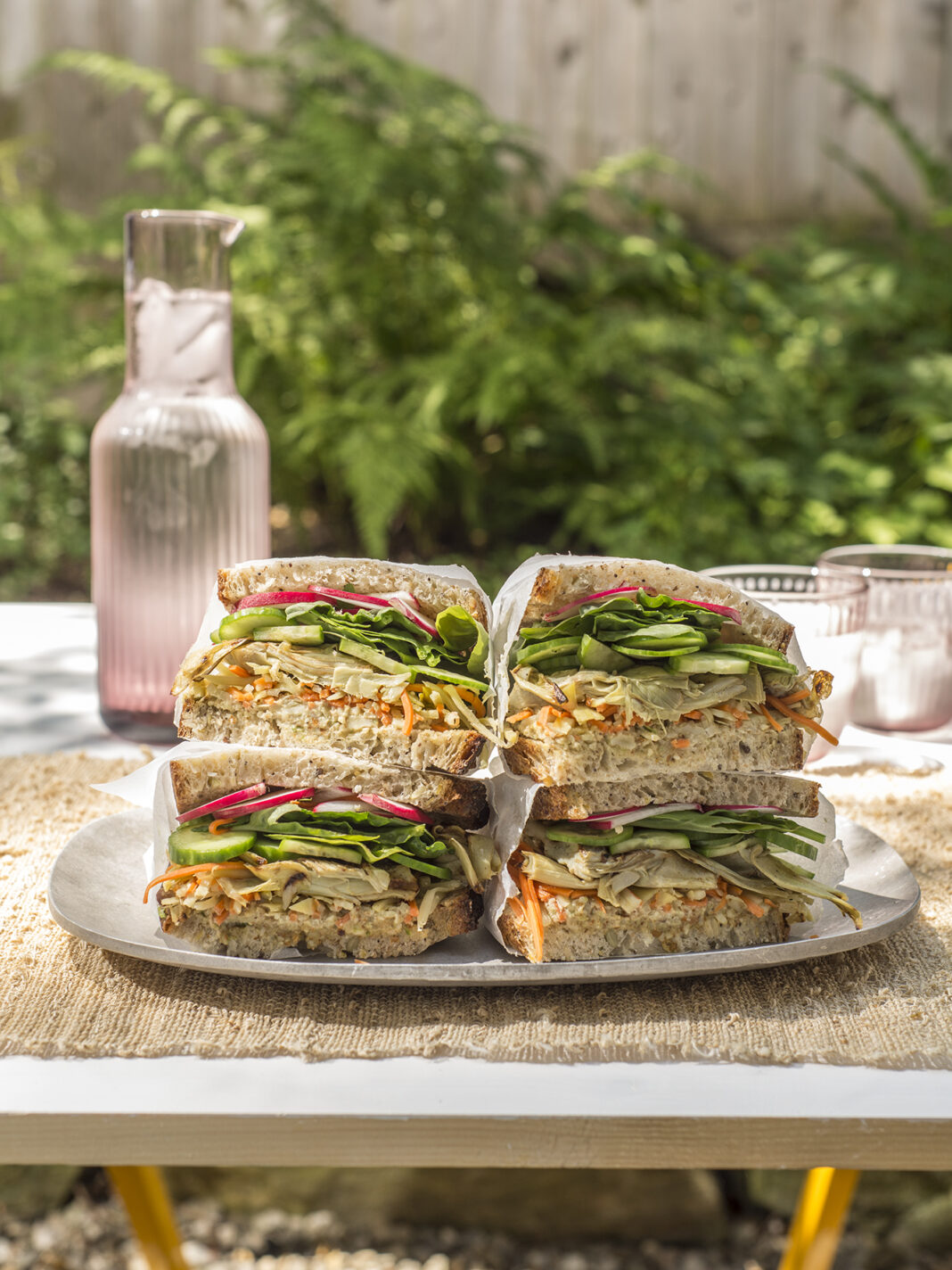 grilled sandwiches stacked on a plate