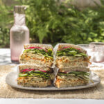 grilled sandwiches stacked on a plate
