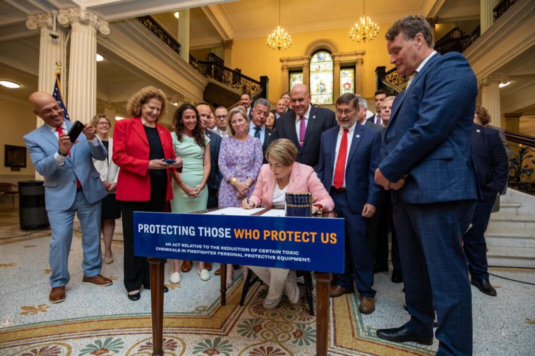 politicians signing a bill