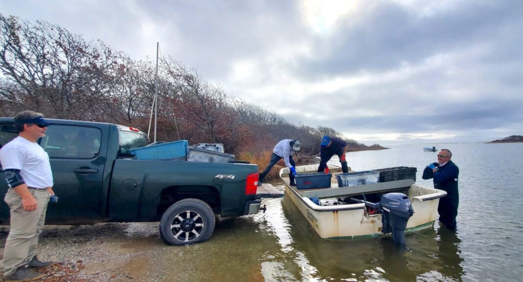 people putting boat into water