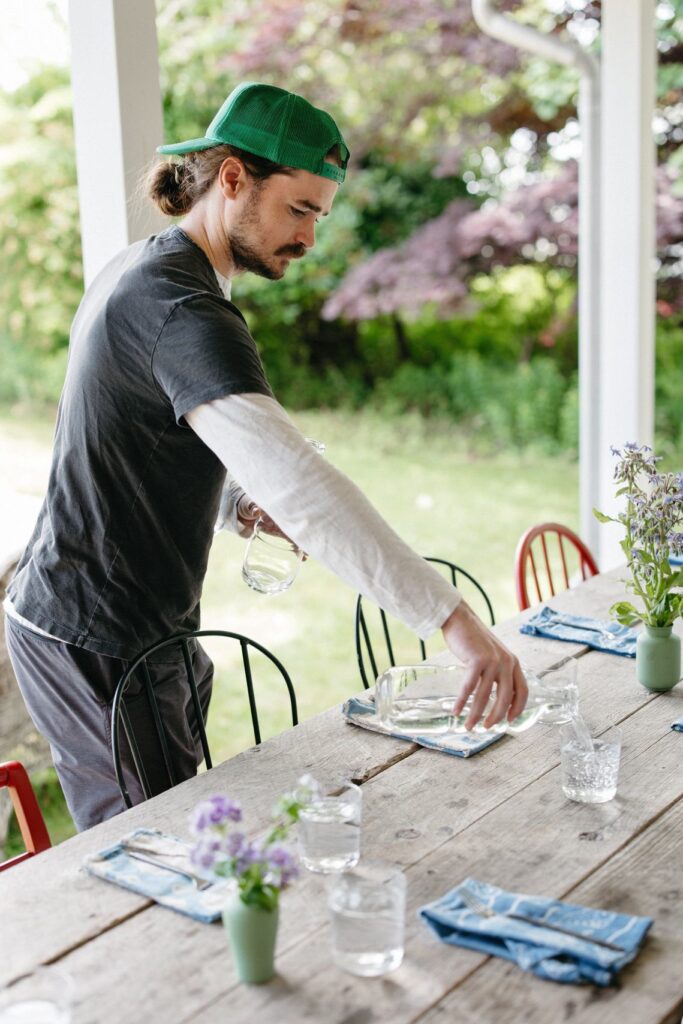 a man setting the table