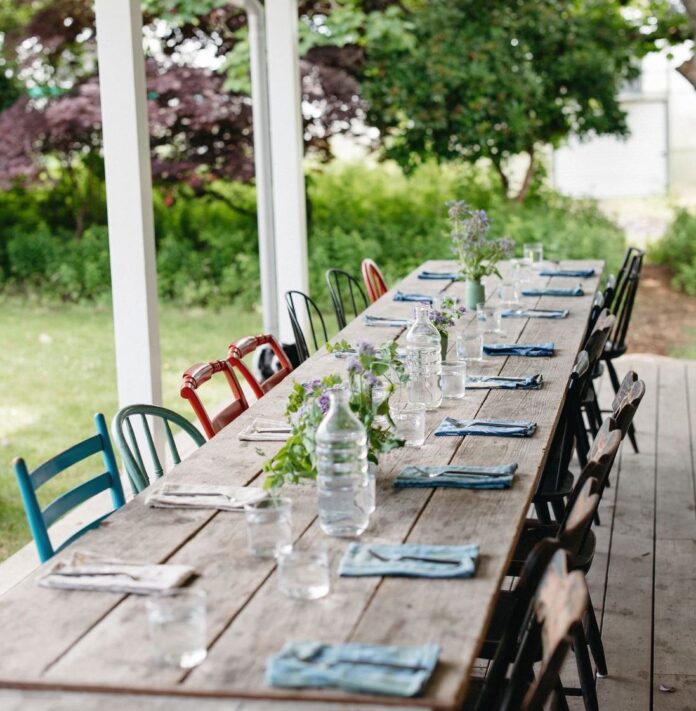set table outside with flowers and napkins
