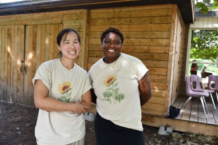 two women shaking hands