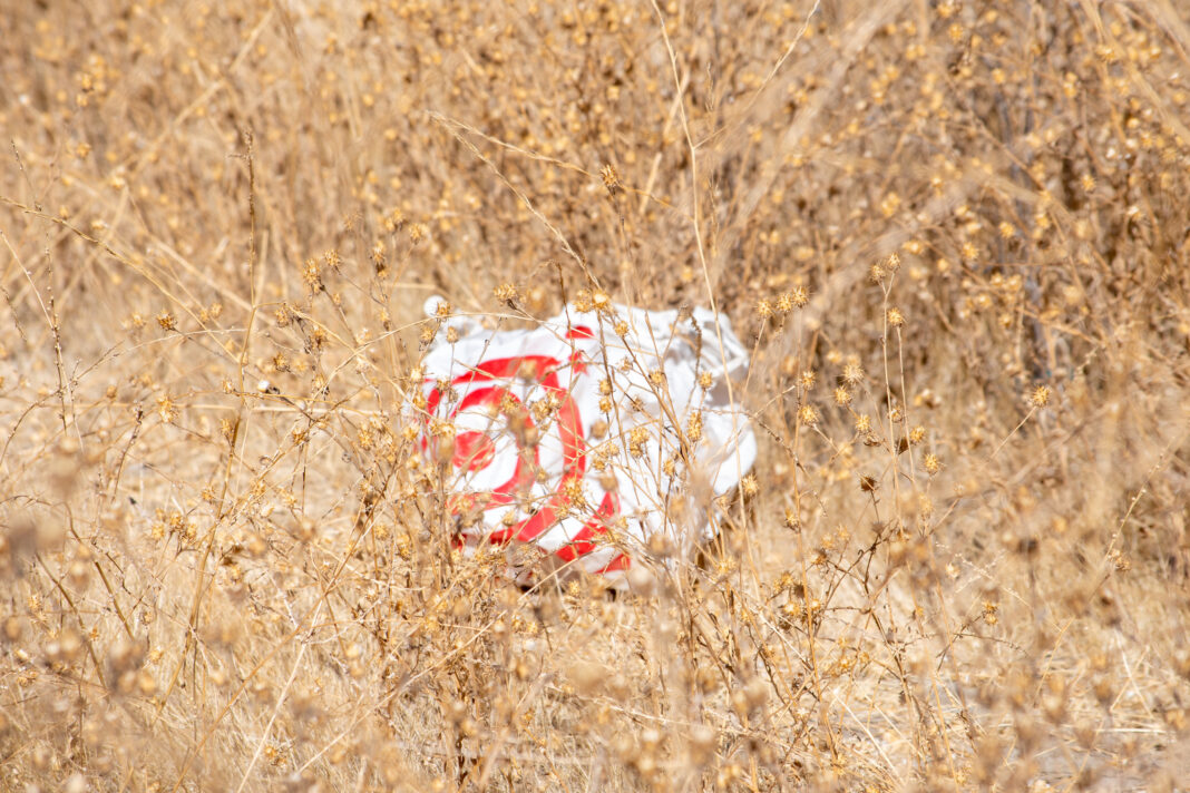 Target plastic bag in field