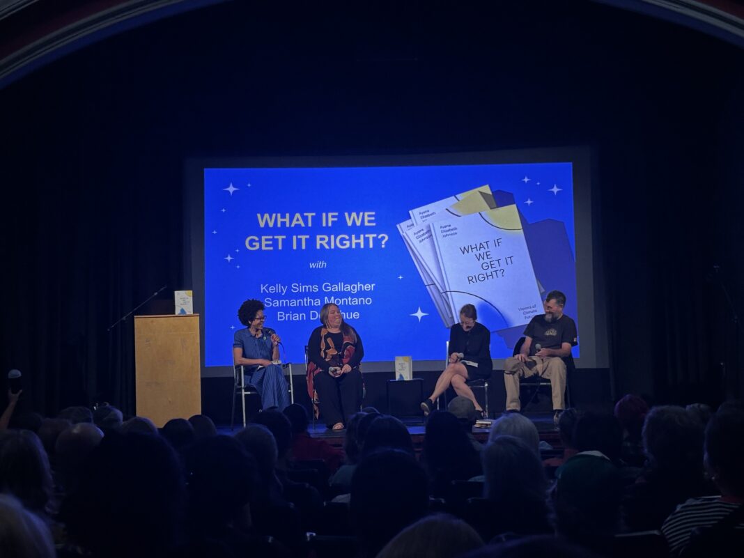 four people talking on a stage