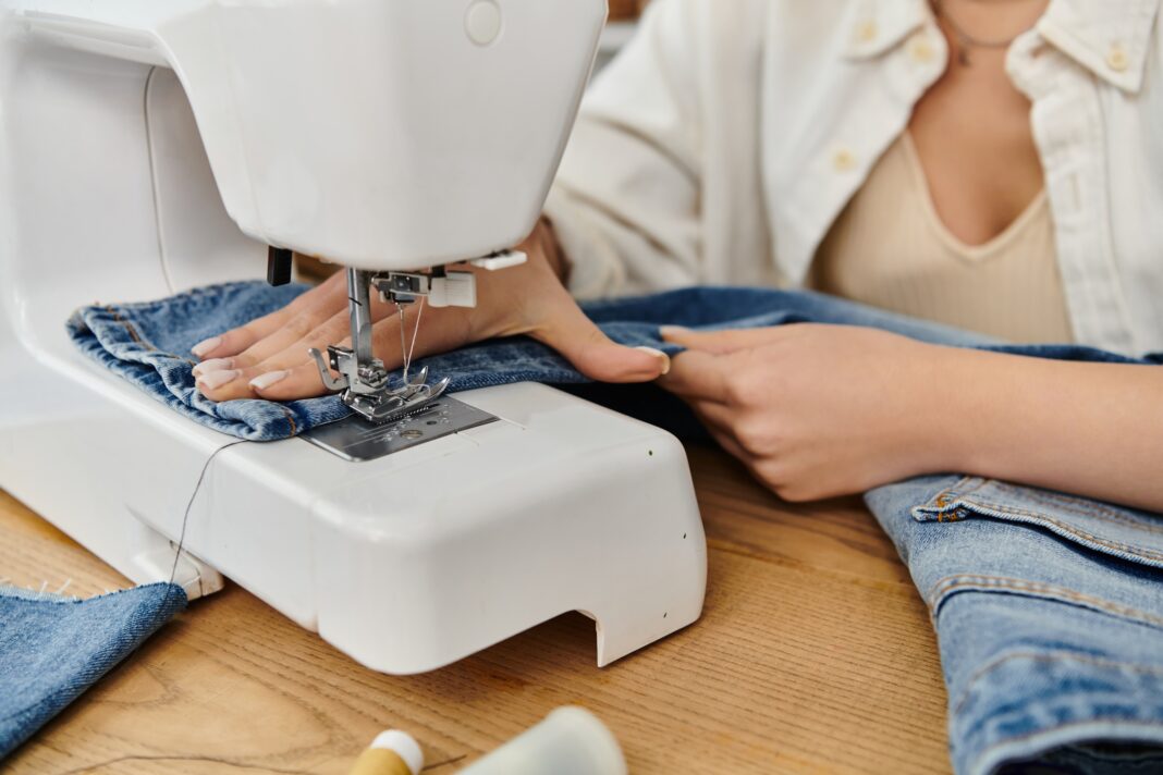 a woman sewing jeans