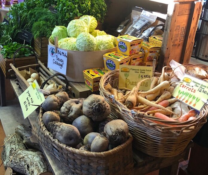 baskets of carrots, potatoes and cabbage