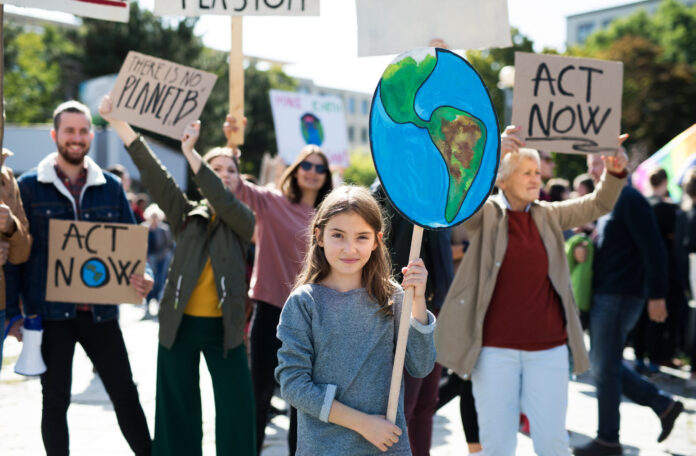people with signs protesting climate change