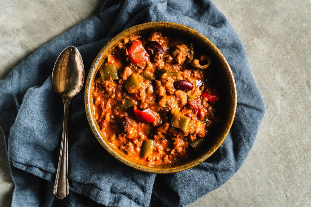 plant based chili in bowl with spoon