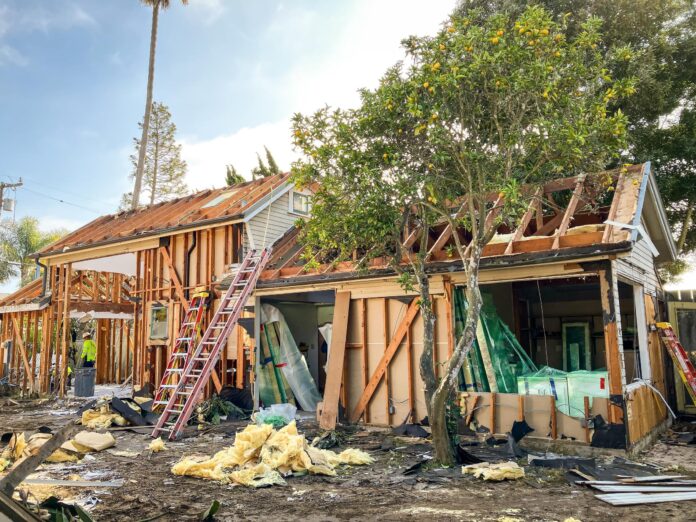 house in process of deconstruction down to frame