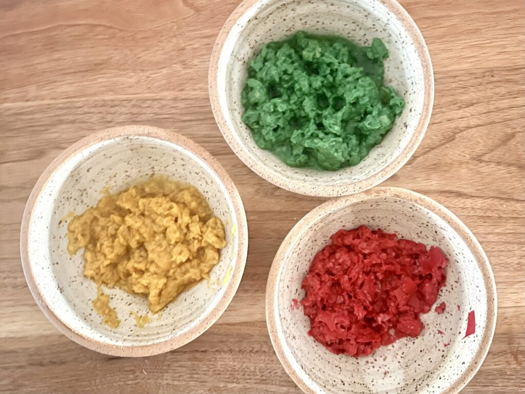 three cups with wet pieces of paper